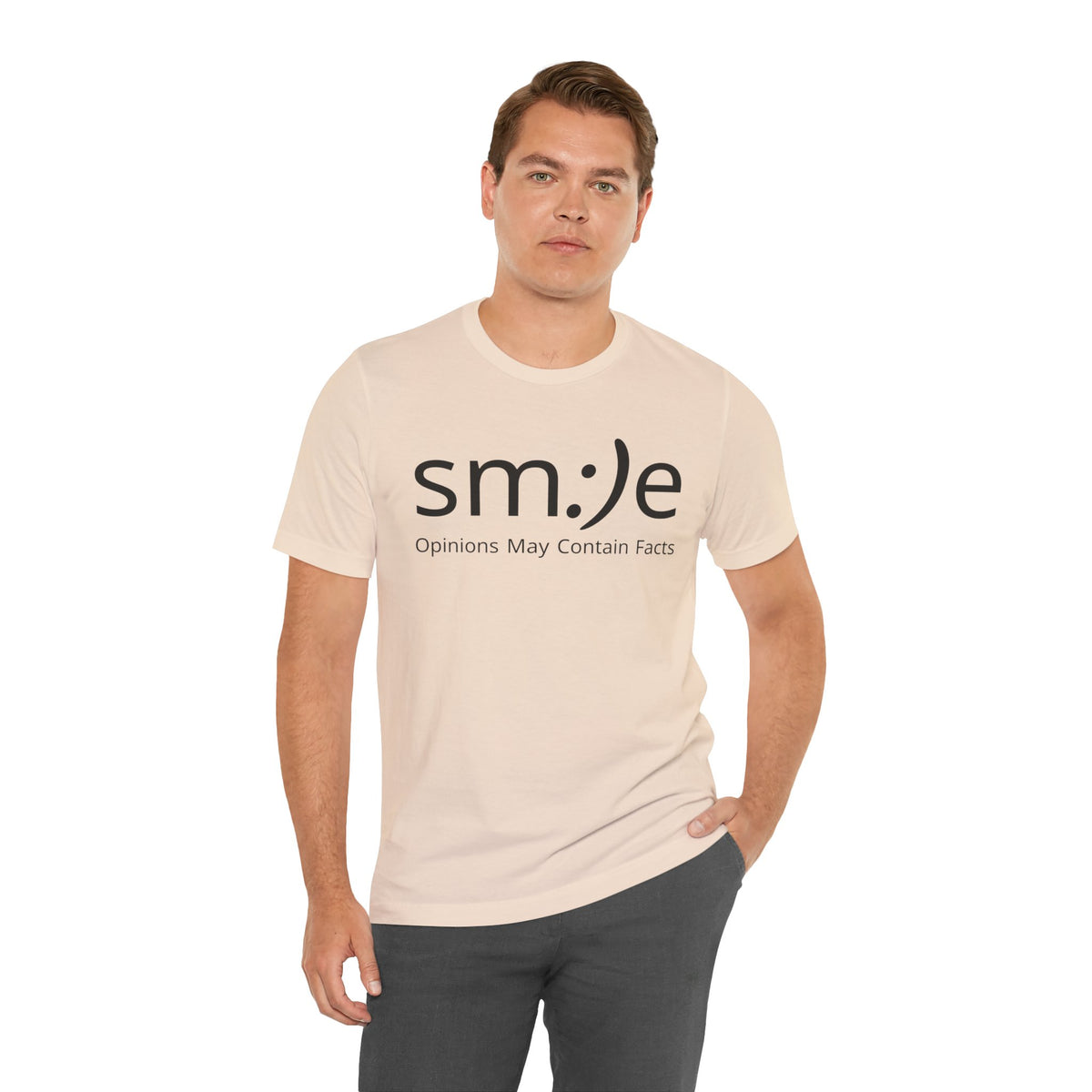 Man wearing a beige t-shirt with 'smile: Opinions May Contain Facts' text on a white background