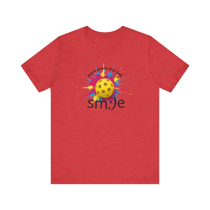Red t-shirt with a colorful smiley face design on a white background