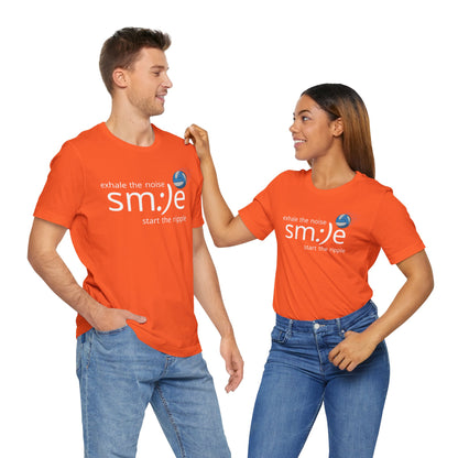 Two people wearing orange t-shirts with a smiley face and text on a white background